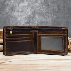 Detailed view of dark brown leather wallet interior with card slots and a clear ID window