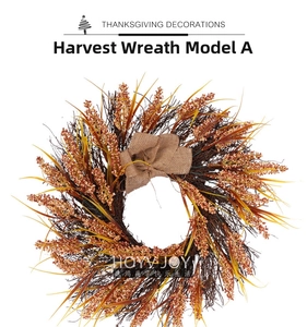 Macro shot of harvest wreath with dry cereal grains and a rustic burlap bow for Thanksgiving