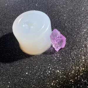 Translucent silicone crystal cluster mold with a purple finished resin volcano stone