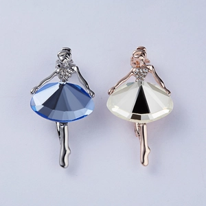 Detail of ballet dancer brooches with large faceted crystals and sparkling rhinestones