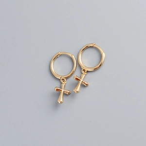 Detail of minimalist gold-plated S925 sterling silver hoop earrings with cross pendants