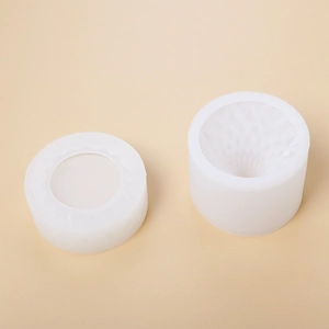 Detail of white silicone storage box mold with geometric facets and honeycomb texture