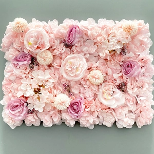 Detail of faux silk flower wall panel featuring pink roses and hydrangeas for decor