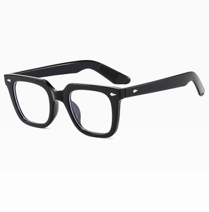Detail of glossy black square frame sunglasses with signature silver diamond rivets