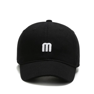 Classic black cotton baseball cap with white embroidered letter M on front, casual style