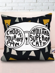 Detailed view of linen cushion cover with cartoon cat print on a home sofa background