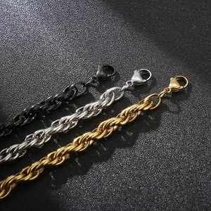 Three-tone stainless steel twist link chains in gold, silver, and black with lobster clasps