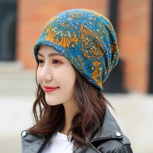Women's warm winter beanie featuring bohemian vintage floral print in blue and orange