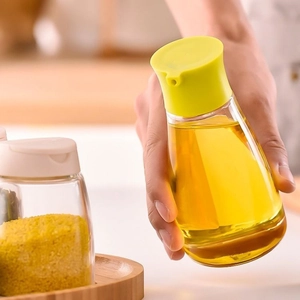 Bouteille d'huile de cuisine en verre ergonomique avec couvercle jaune anti-fuite