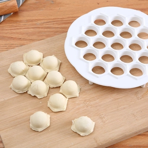 White 19-hole hexagonal dumpling maker mold for efficient home kitchen dough pressing