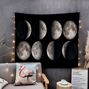 Detail of moon phase tapestry showing realistic lunar cycle on black background