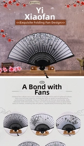 Detail of traditional Chinese bamboo folding fan featuring plum blossom and butterfly motifs