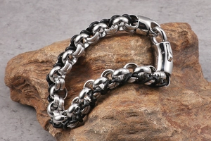 Detail of 316L stainless steel buckle with engraving on a black leather bracelet