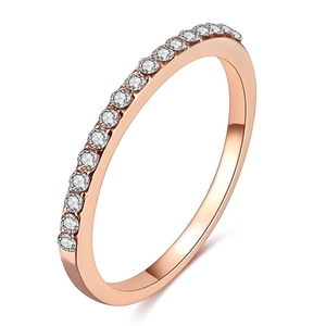 Close-up of minimalist rose gold ring featuring a half-circle of micro-pave zircons