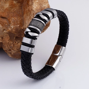 Men's black braided leather bracelet with stainless steel magnetic clasp on rock