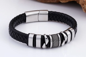 Detailed macro of black braided leather men's bracelet with silver stainless steel clasp