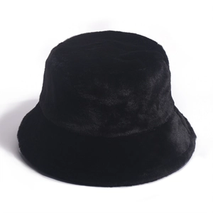 Detail of black faux rabbit fur texture on a thick warm winter bucket hat for women