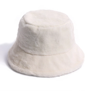 Close-up of white plush bucket hat with soft rabbit fur texture for winter warmth