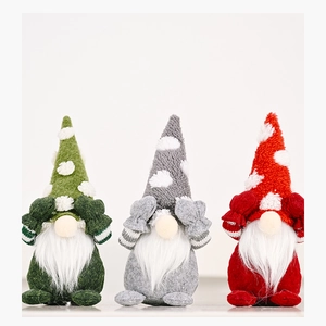 Three Christmas gnomes in green, grey, and red with hands covering eyes on white background