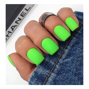 Neon green matte square-round press-on nails shown against blue denim background