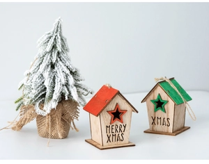 Festive wooden Christmas house ornaments with Merry Xmas text and a mini snowy pine tree