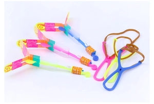 Detail of LED slingshot helicopters in mixed colors with rubber launchers and light-up wings