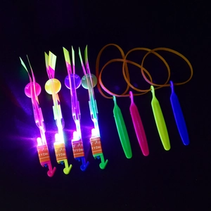 Detailed set of four LED flying slingshot arrows with colorful glowing lights and launchers