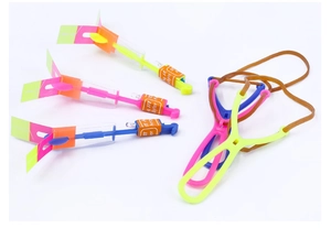 Detail view of colorful LED arrow helicopters with slingshot launchers for night play
