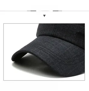 Close-up of the reinforced brim with dense stitching on this grey checkered baseball cap