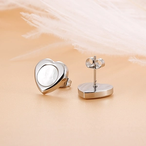 Chic heart-shaped shell stud earrings in stainless steel with elegant white pearl inlay