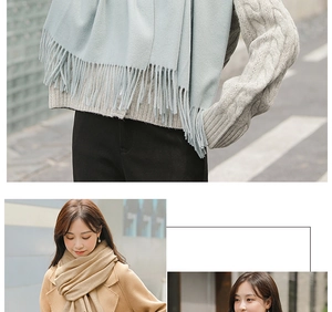 Close-up of soft cashmere scarf with tassel fringe details in light blue and camel