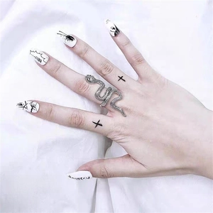 Detailed view of silver snake-shaped adjustable alloy ring with realistic scale texture