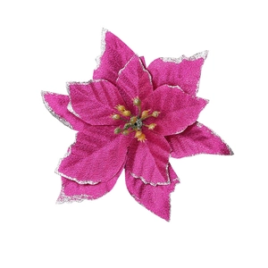 Detail of rose pink artificial Christmas poinsettia flower with silver glitter edges