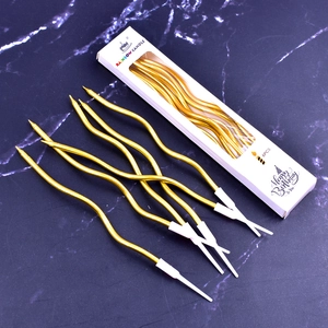 6-pack of elegant gold spiral birthday candles on dark marble background