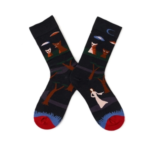 Detail shot of crew socks featuring Henri Rousseau artistic pattern on a white background