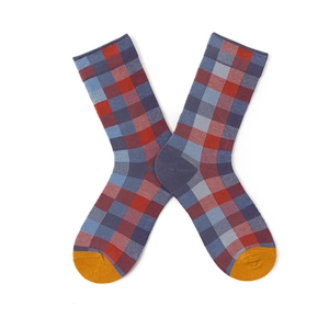 Detail view of cotton mid-calf socks with red and blue plaid pattern and yellow toes