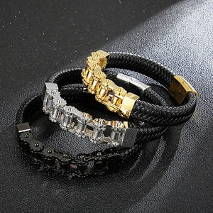 Three men's woven leather bracelets with gold, silver and black gear metal chain designs