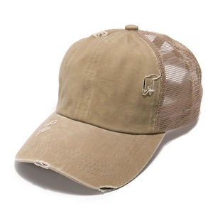 Close-up of distressed vintage denim baseball cap with ponytail hole and breathable mesh back