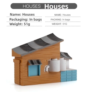 Miniature brown farm house toy model with blue windows and grey roof for DIY sandbox decor