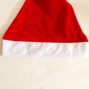 Close-up of red velvet Christmas hat showing plush white fur trim and soft fabric texture