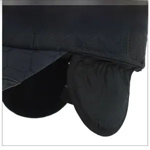 Detail of black quilted winter baseball cap featuring thickened ear flaps and honeycomb stitching