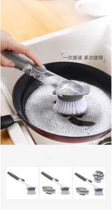 Detail of grey kitchen pot brush showing long handle and transparent liquid reservoir