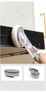 Detail of soap dispensing dish brush with interchangeable sponge and bristle heads