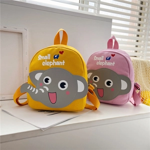 Detail of cute canvas elephant backpacks in yellow and pink for toddlers and preschool