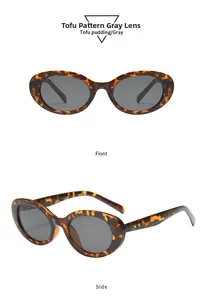 Detail der ovalen Sonnenbrille in Schildpatt-Optik mit goldenen Sternen am Bügel