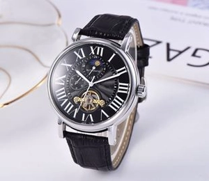 Macro view of automatic watch dial with Roman numerals, moon phase, and open heart display