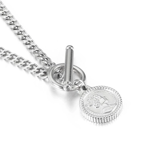 Silver Cuban link necklace with Queen coin pendant and T-bar toggle clasp on white background