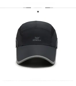 Detail of quick-dry black sports baseball cap with mesh panels and gray brand logo