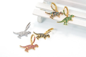 Detailed macro view of colorful dinosaur earrings with micro-set multi-color zircons