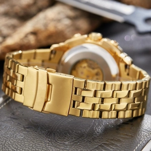 Men's gold automatic mechanical watch with visible inner movement and link bracelet